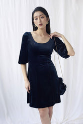 Velvet midi dress with puff sleeves and scoop neckline for elegant day-to-evening styling